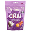 A purple stand-up pouch of Chimes Spiced Chai Hard Toffee, featuring illustrations of a coconut, yellow taffy, cinnamon sticks, and a Non-GMO Verified seal on a white background.